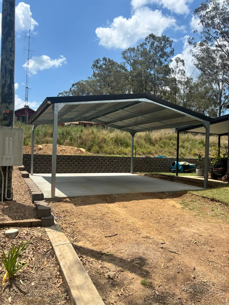 Compact carport in Yarraman — COLORBOND Monument roofing and trim