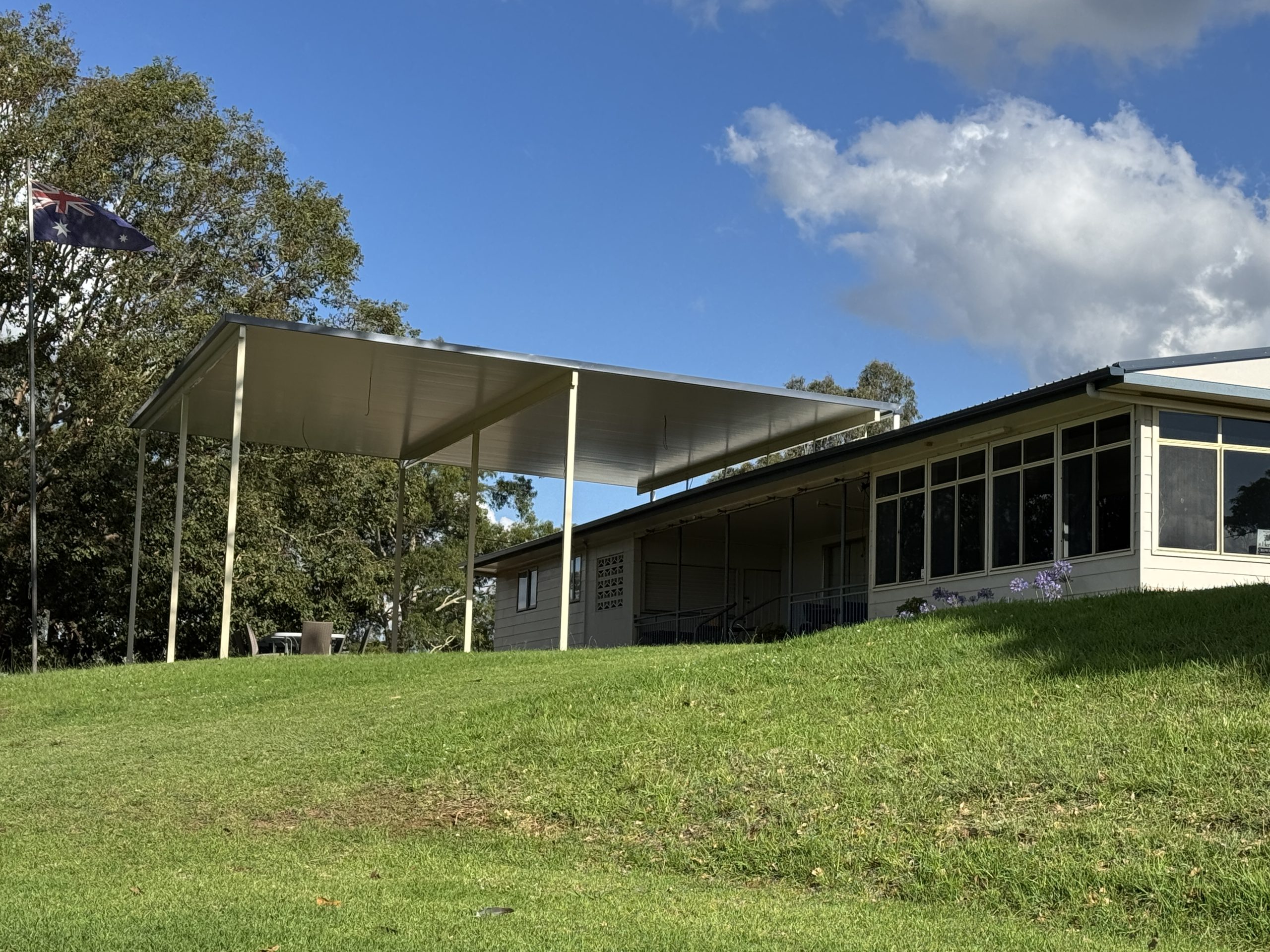 Wide view of flyover over existing clubhouse